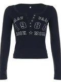 dark blue long sleeve top with letter