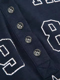 dark blue long sleeve top with letter